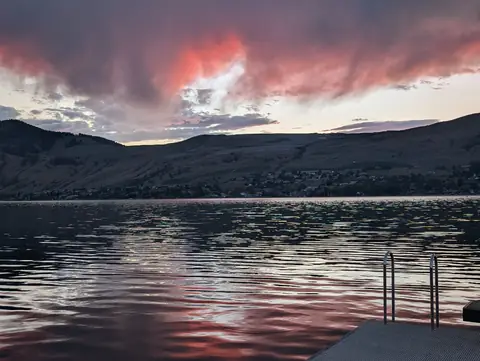 Pink storm clouds over the lake at sunset, Okanagan Lake at Okanagan Landing, Vernon, B.C., June 21, 2026