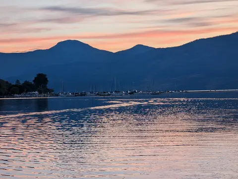 Pink and blue sunset over the mountains, Okanagan Lake at Okanagan Landing, Vernon, B.C., September 17, 2024