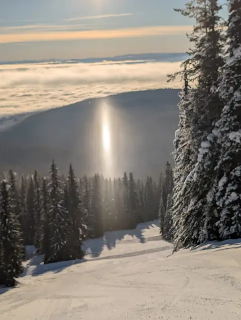 Morning sun pillar over a ski run, SilverStar Mountain Resort, near Vernon, B.C., January 26, 2025