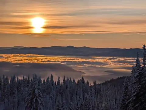 Sun setting over a sea of valley cloud, SilverStar Mountain Resort, near Vernon, B.C., December 9, 2024